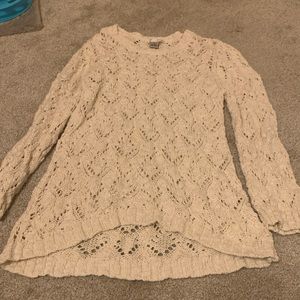 long sweater, with holes, used as a cover up